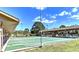 Community shuffleboard courts with covered seating areas at 605 Apple Ln, Englewood, FL 34223