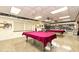 Community game room featuring two billiard tables and a library at 605 Apple Ln, Englewood, FL 34223