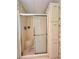 Updated bathroom with walk-in shower and built-in storage at 786 Heathercreek Ct, Englewood, FL 34223