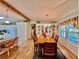 Dining room with a wooden table and hutch, and hardwood floors at 786 Heathercreek Ct, Englewood, FL 34223