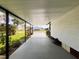 Covered carport with view of neighboring homes at 786 Heathercreek Ct, Englewood, FL 34223