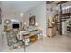 Comfortable living room with large artwork, stylish furniture, and tiled floors at 1141 Sleepy Hollow Ct, Venice, FL 34285