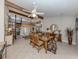 Elegant dining room with glass-top table and a spiral staircase at 1141 Sleepy Hollow Ct, Venice, FL 34285