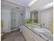 Modern bathroom with a large vanity and walk-in shower at 1141 Sleepy Hollow Ct, Venice, FL 34285