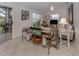 Cozy living room featuring a comfortable sofa and lake view at 1141 Sleepy Hollow Ct, Venice, FL 34285