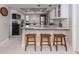 Modern kitchen with granite countertops and white cabinets at 1141 Sleepy Hollow Ct, Venice, FL 34285