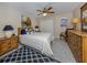 Bedroom with wood furniture, a comfortable bed, and nautical decor at 1141 Sleepy Hollow Ct, Venice, FL 34285