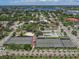 Aerial view of tennis courts and basketball court near waterfront at 1141 Sleepy Hollow Ct, Venice, FL 34285