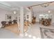 Open living area with tiled floors and seating areas at 1141 Sleepy Hollow Ct, Venice, FL 34285