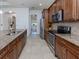 Well-equipped kitchen, stainless steel appliances, granite counters at 127 Sevilla Pl, North Venice, FL 34275