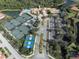 Aerial view showing tennis courts, pickleball courts, and clubhouse at 127 Sevilla Pl, North Venice, FL 34275