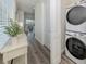 Convenient laundry room with stacked washer and dryer at 128 Clifton Way, Venice, FL 34292