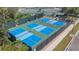 Four well-maintained pickleball courts at 150 Bella Vista Ter # 15B, Nokomis, FL 34275