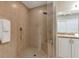 Large walk-in shower with glass enclosure and built-in seat at 150 Bella Vista Ter # 15B, Nokomis, FL 34275