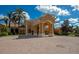 Community clubhouse entrance with arched entryway and columns at 150 Bella Vista Ter # 15B, Nokomis, FL 34275