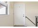 White front door with a window and a railing at 1743 Lake Pl # 1743C, Venice, FL 34293