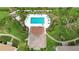 Community pool with lounge chairs and surrounding landscaping at 1743 Lake Pl # 1743C, Venice, FL 34293