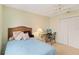 Bedroom with a bed, desk and large closet at 1743 Lake Pl # 1743C, Venice, FL 34293