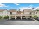 Front view of the building and carport at 1743 Lake Pl # 1743C, Venice, FL 34293