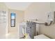 Laundry room with washer, dryer and shelving at 1743 Lake Pl # 1743C, Venice, FL 34293