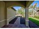 Covered entryway with arched detail and view of the backyard at 19140 Mangieri St, Venice, FL 34293