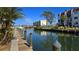 Wooden walkway and dock leading to the canal at 250 Santa Maria St # 118, Venice, FL 34285