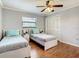 Bright bedroom with two twin beds, nightstands, and a large closet at 2512 Regatta Dr, Sarasota, FL 34231