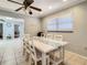 Dining area with white table and chairs, and a ceiling fan at 2512 Regatta Dr, Sarasota, FL 34231