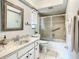 Bathroom with vanity, mirror, toilet, and shower at 2512 Regatta Dr, Sarasota, FL 34231