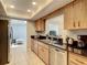 Updated kitchen, featuring stainless steel appliances and granite countertops at 2512 Regatta Dr, Sarasota, FL 34231