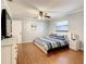 Bedroom with king-size bed, dresser, and hardwood floors at 2512 Regatta Dr, Sarasota, FL 34231