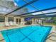 Relaxing screened-in pool with patio furniture at 2512 Regatta Dr, Sarasota, FL 34231