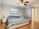 Main bedroom with king-size bed and hardwood floors at 2512 Regatta Dr, Sarasota, FL 34231