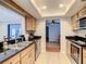 Kitchen with stainless steel appliances and wood cabinets at 2512 Regatta Dr, Sarasota, FL 34231
