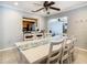 Dining area with white table and chairs, and a view of the kitchen at 2512 Regatta Dr, Sarasota, FL 34231