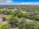Aerial view showing home's location in a residential neighborhood near water at 2512 Regatta Dr, Sarasota, FL 34231