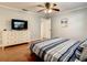 Bedroom with king-size bed, dresser, and hardwood floors at 2512 Regatta Dr, Sarasota, FL 34231