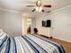 Main bedroom with king bed, dresser, and walk-in closet at 2512 Regatta Dr, Sarasota, FL 34231
