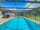 Refreshing screened-in pool, perfect for relaxation at 2512 Regatta Dr, Sarasota, FL 34231