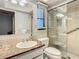 Bathroom with shower, toilet, and granite countertop at 2512 Regatta Dr, Sarasota, FL 34231