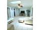 Bright living room with vaulted ceiling and skylights at 2512 Regatta Dr, Sarasota, FL 34231