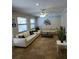 Living room with beige sofas and a ceiling fan at 2512 Regatta Dr, Sarasota, FL 34231