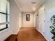 Simple entryway with hardwood floors and mirror at 2512 Regatta Dr, Sarasota, FL 34231