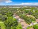 Aerial view showing neighborhood homes nestled among mature trees and lush landscaping at 2512 Regatta Dr, Sarasota, FL 34231