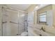 Clean bathroom with shower, grab bars, and white tile at 261 Malvern Dr, Venice, FL 34293