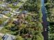 Aerial view showing home's location on a large lot near water at 3331 Traverse Ave, North Port, FL 34286