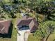 Aerial view of single story home, driveway, and large backyard with trees at 3331 Traverse Ave, North Port, FL 34286