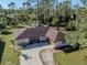 Aerial view of home with driveway and large yard at 3331 Traverse Ave, North Port, FL 34286