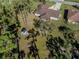 House and backyard with a shed, trees and a partially visible fence at 3331 Traverse Ave, North Port, FL 34286