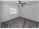 Bright bedroom with carpeted floor and large window at 3331 Traverse Ave, North Port, FL 34286